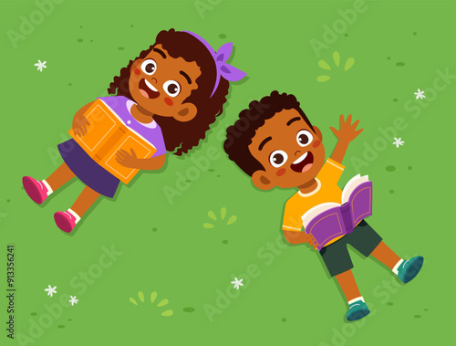 little kid lay down and read book on park and feel happy