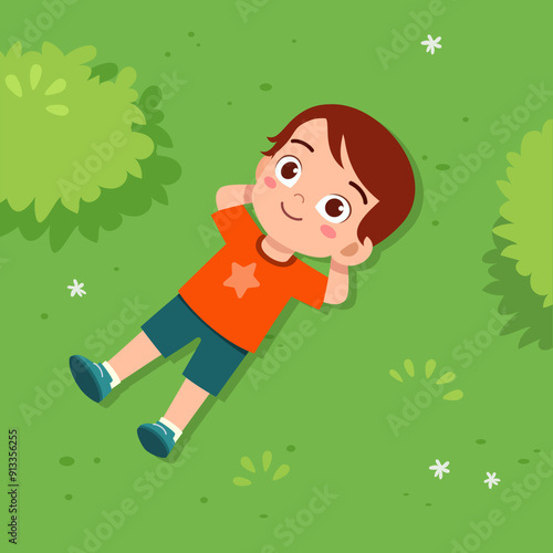 little kid lay down on park and feel happy