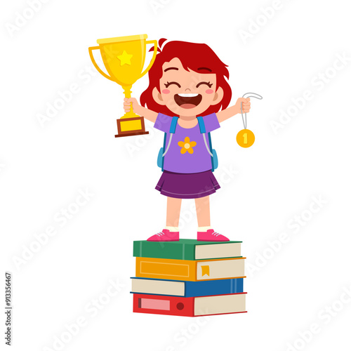 little kid standing and holding book and golden trophy