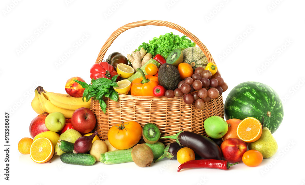 Many different fruits and vegetables in wicker basket isolated on white Many different fruits and vegetables in wicker basket isolated on white