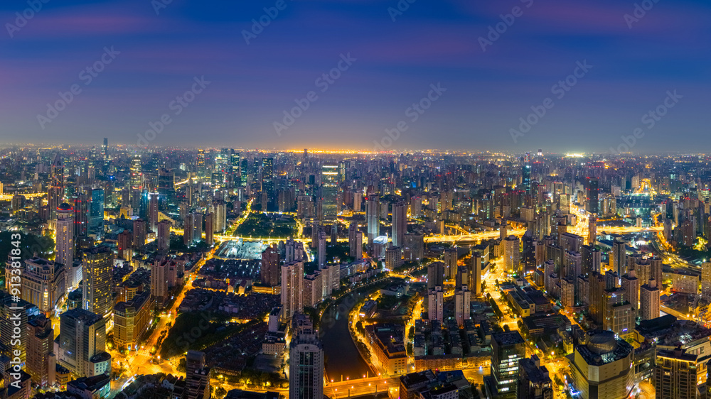 Aerial view of modern city skyline and burning clouds at sunrise in Shanghai. Aerial view of modern city skyline and burning clouds at sunrise in Shanghai.
