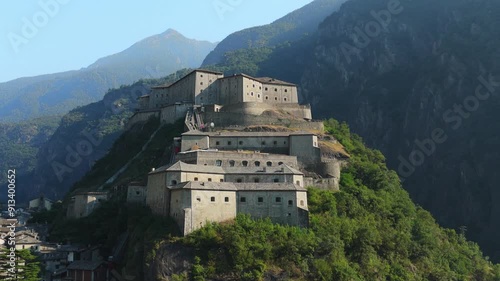 Wallpaper Mural Historic Fort Bard in Aosta Valley surrounded by lush green hills and majestic mountains Torontodigital.ca