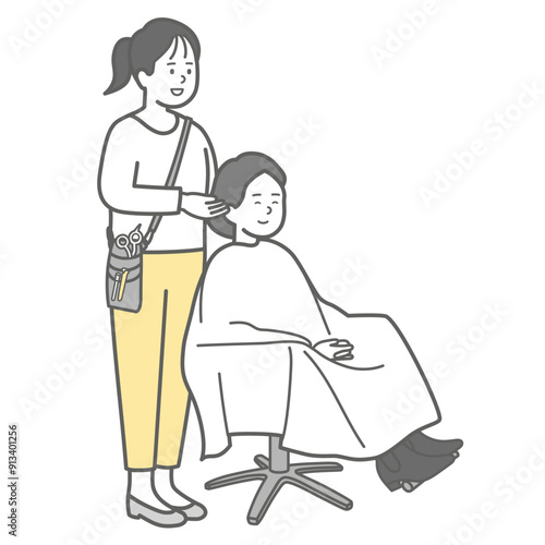 ヘアサロンで髪のカウンセリングする美容師とお客さん