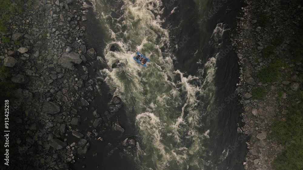 Top down aerial of rafter in Snake River rapids in Hells Canyon Idaho Top down aerial of rafter in Snake River rapids in Hells Canyon Idaho