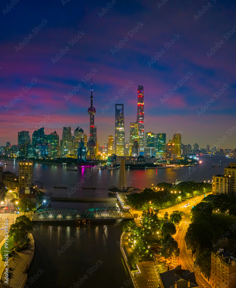 Obraz premium Aerial view of modern city skyline and burning clouds at sunrise in Shanghai