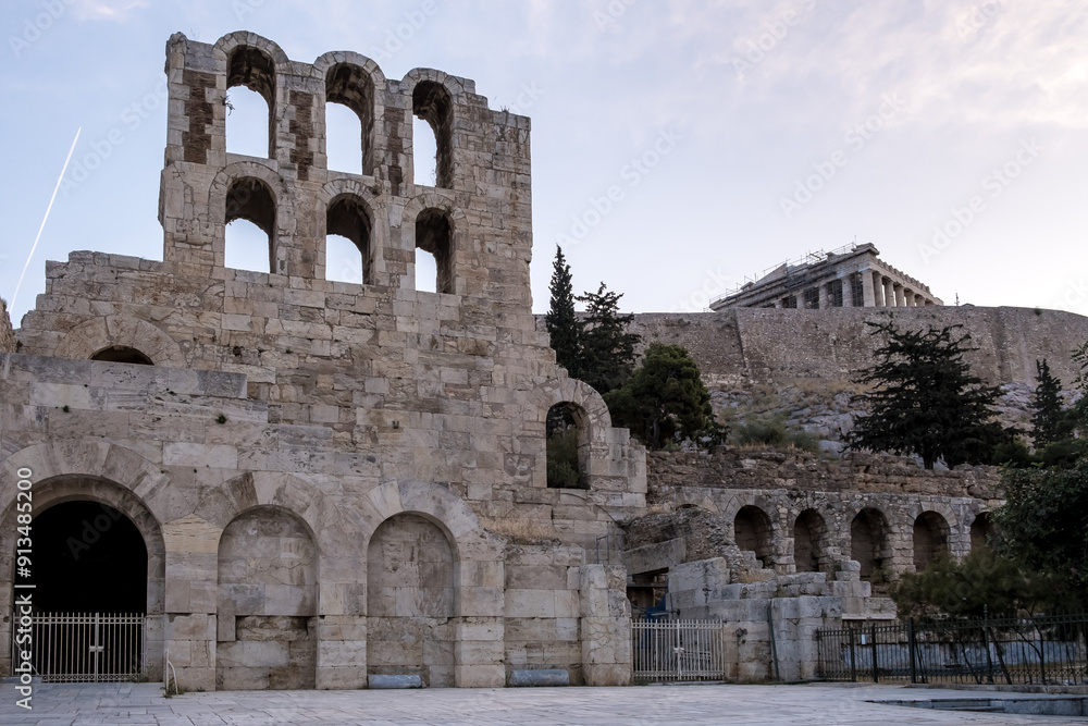 Sunrise view of the Acropolis of Athens, a historic fortress on a rocky hill above Athens, Greece. It features the ruins of several ancient structures, most notably the Parthenon. Sunrise view of the Acropolis of Athens, a historic fortress on a rocky hill above Athens, Greece. It features the ruins of several ancient structures, most notably the Parthenon.
