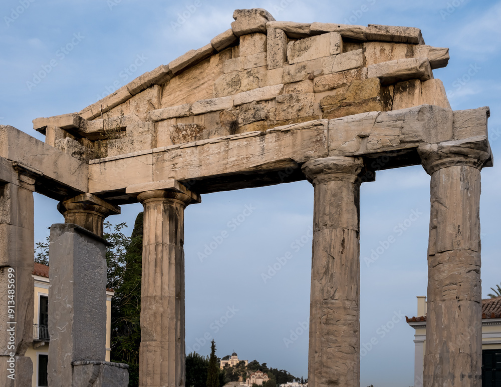 Sunrise view of the Roman Agora in Athens' Old Town, featuring the Gate of Athena Archegetis situated north of the Acropolis and east of the Ancient Agora. Sunrise view of the Roman Agora in Athens' Old Town, featuring the Gate of Athena Archegetis situated north of the Acropolis and east of the Ancient Agora.