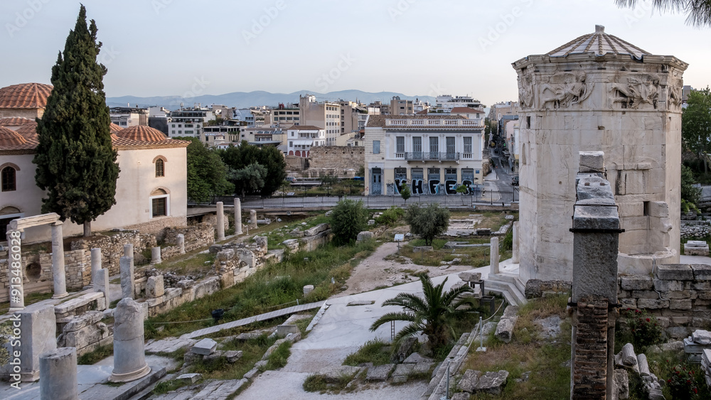 Sunrise view of the Roman Agora, located in the Old Town of Athens, north of the Acropolis and east of the Ancient Agora. These ruins date back to the Roman period. Sunrise view of the Roman Agora, located in the Old Town of Athens, north of the Acropolis and east of the Ancient Agora. These ruins date back to the Roman period.