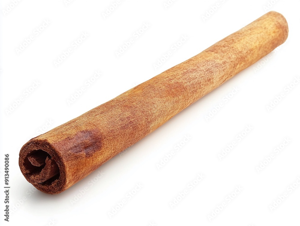 A single cinnamon stick on a white background A single cinnamon stick on a white background
