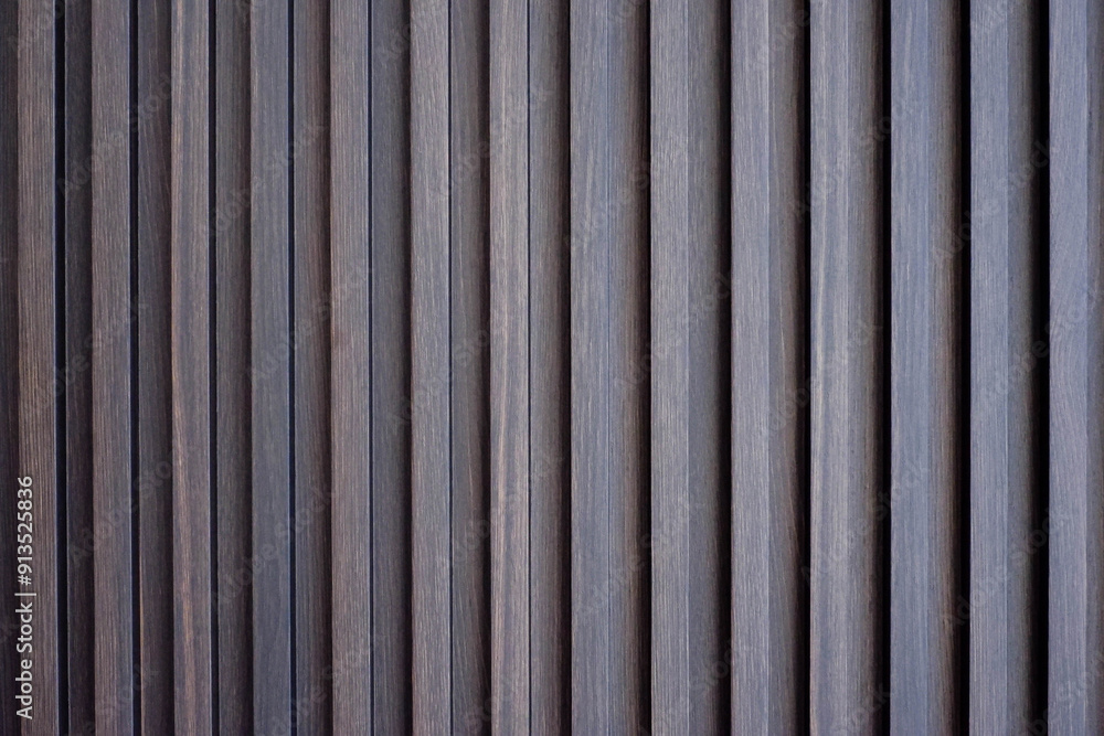 Wood battens wall straight line background texture. Architecture indoor and outdoor material in brown color. Wood battens wall straight line background texture. Architecture indoor and outdoor material in brown color.