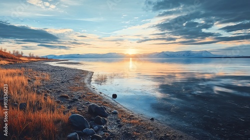 Arctic beach bathed in the last rays of the sun photo