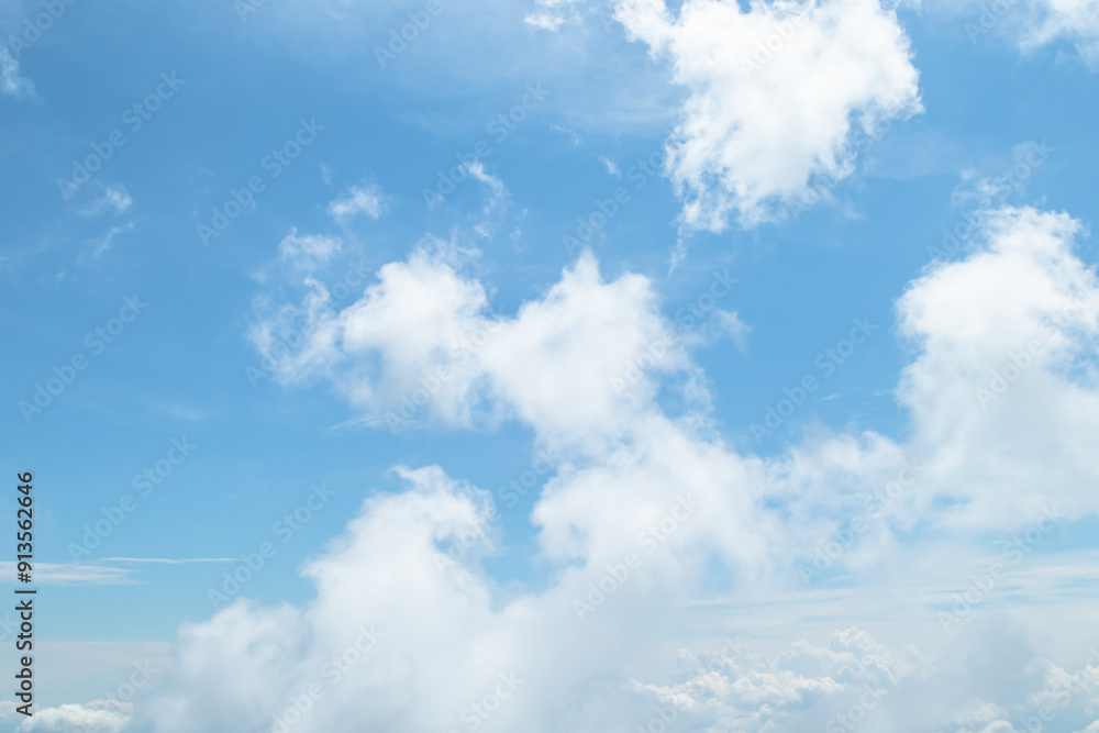 Morning view over white puffy clouds with blue sky on horizon. Morning view over white puffy clouds with blue sky on horizon.