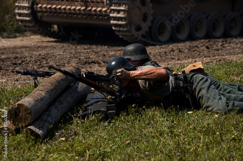 German infantry - soldiers of World War II on the battlefield. unrecognizable persons. Aquino Tank Weekend -  historical military show. Oshawa, Ontario, Canada