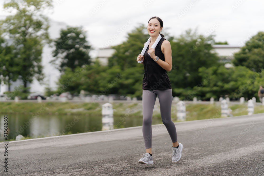 Asian girl jogging
Exercise in the morning with headphones on and a happy smile. Asian girl jogging
Exercise in the morning with headphones on and a happy smile.