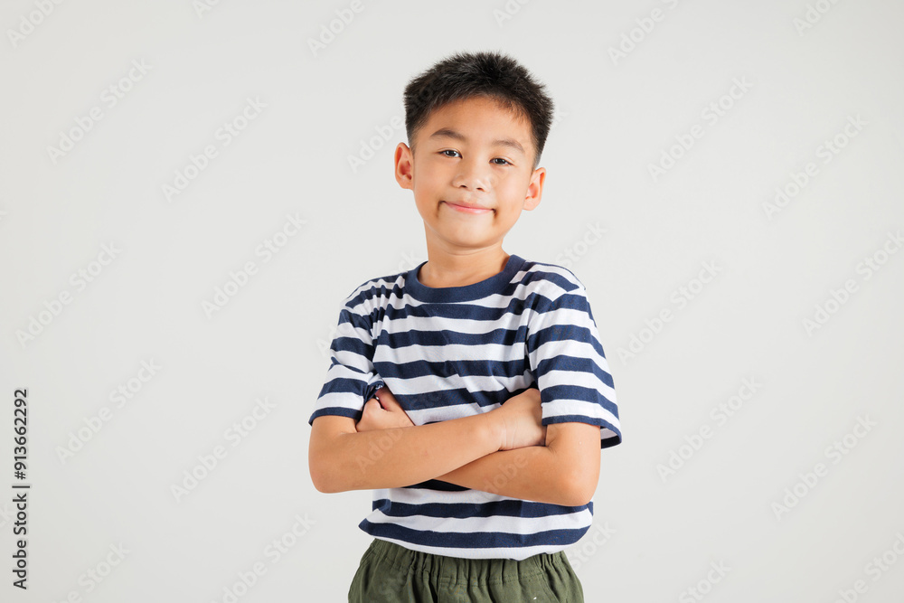 Asian happy portrait cute young kid boy smiling confidence with arms crossed studio shot isolated on white background and copy space, primary children person lifestyle arm folded Asian happy portrait cute young kid boy smiling confidence with arms crossed studio shot isolated on white background and copy space, primary children person lifestyle arm folded