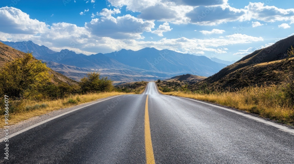 Fototapeta premium A long road with a mountain in the background