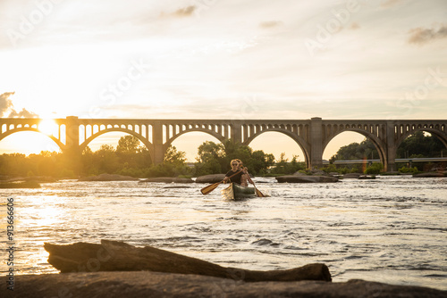 Couple canoeing on a river. photo