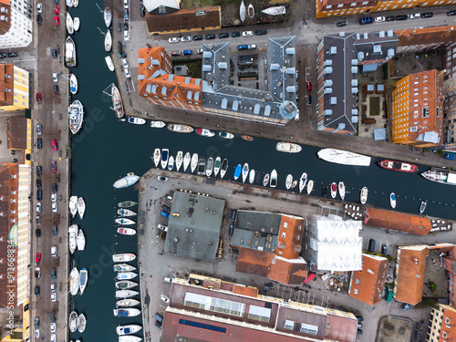 Copenhagen, Denmark: Aerial overhead view of the Christiana Neighbourhood with boats along a canal in Copenhagen, Denmark capital city