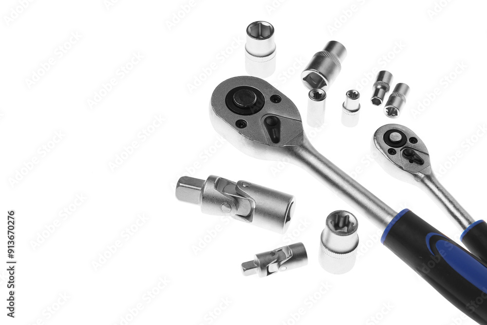 Two torque wrenches and nuts on white background. Auto mechanic tools Two torque wrenches and nuts on white background. Auto mechanic tools