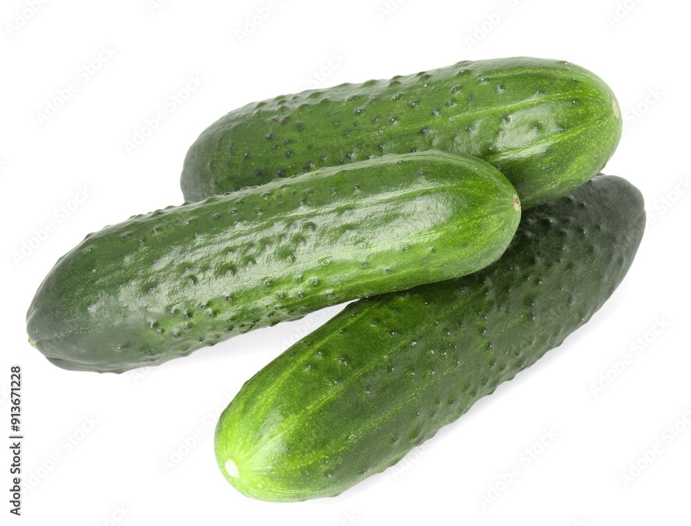 Three fresh green cucumbers isolated on white, above view Three fresh green cucumbers isolated on white, above view