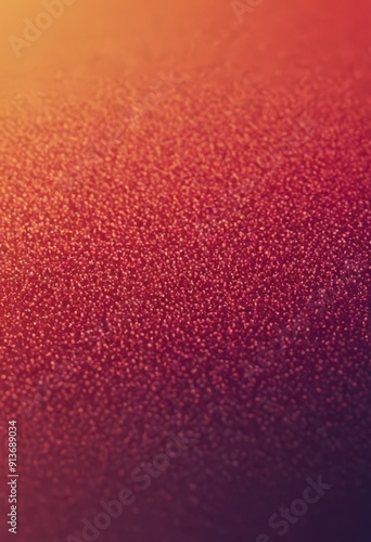 gradient background transitions from warm orange to deep purple, with textured, speckled appearance. photo