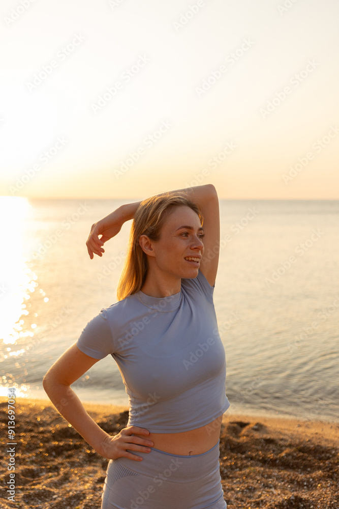 Woman stretching at beach during sunrise.Concept of exercise. Woman stretching at beach during sunrise.Concept of exercise.