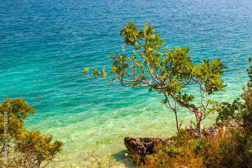 The peninsula Karaburun in Albania near the city of Vlore. A touristic hotspots for daytrips to swim in the crystal clear waters and it marks the border between the Adriatic and Ionian seas photo