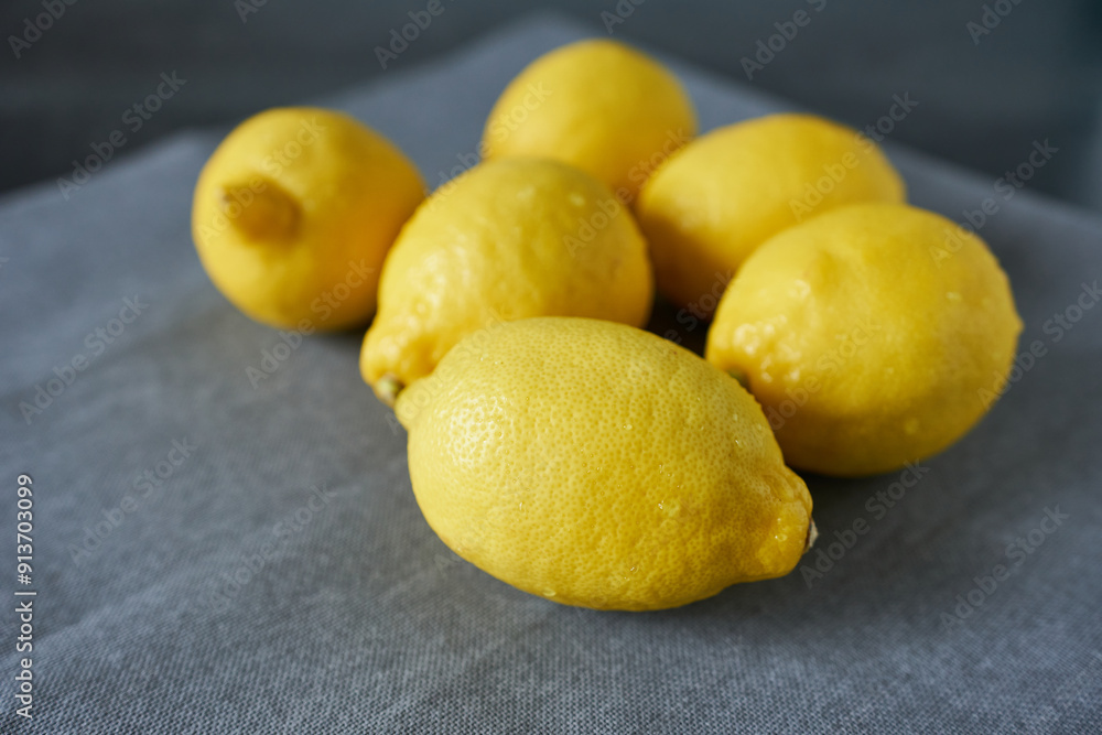 Lemons on a gray napkin, selective focus, close-up Lemons on a gray napkin, selective focus, close-up