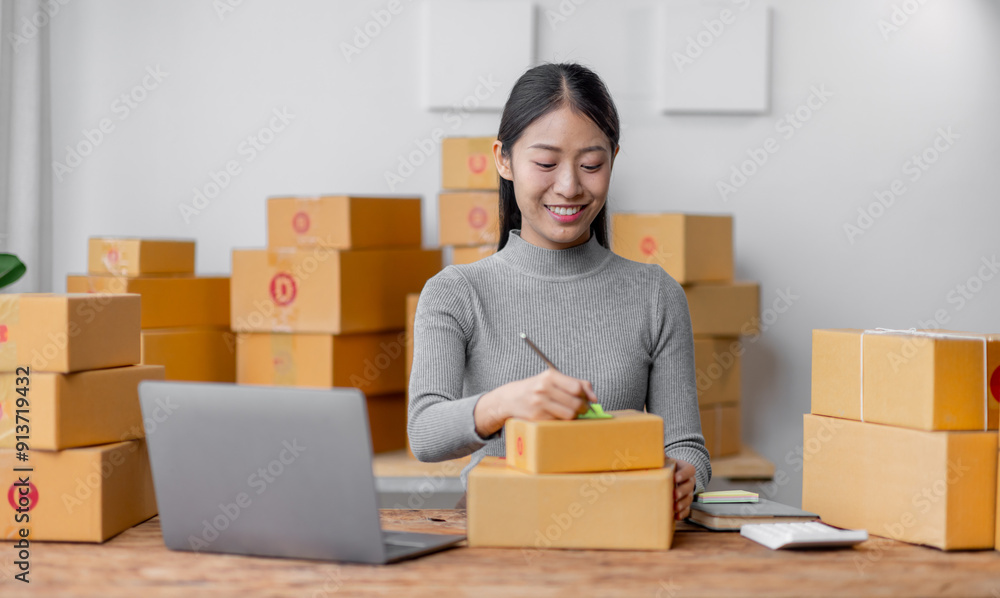 Attractive young freelancer SME owners asian woman entrepreneurs working on receipt box and check online orders, SME home business ideas online. Attractive young freelancer SME owners asian woman entrepreneurs working on receipt box and check online orders, SME home business ideas online.