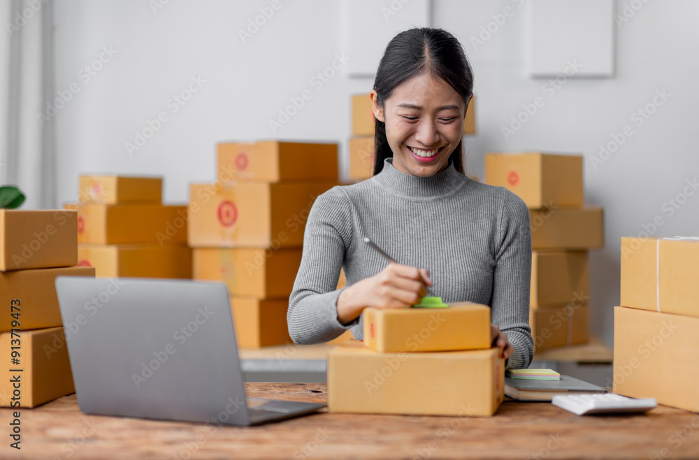Attractive young freelancer SME owners asian woman entrepreneurs working on receipt box and check online orders, SME home business ideas online. Attractive young freelancer SME owners asian woman entrepreneurs working on receipt box and check online orders, SME home business ideas online.