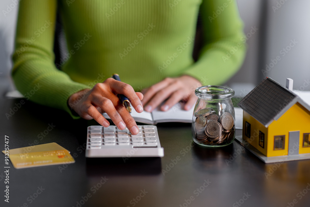 saving money, Real estate concept background. Hand of House model and coins stack on wooden table, Business and tax concept copy space. saving money, Real estate concept background. Hand of House model and coins stack on wooden table, Business and tax concept copy space.