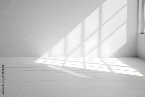 A bright white room with light shining through the window, casting soft shadows on an empty wall. creating an abstract and minimalist background for product display or presentation