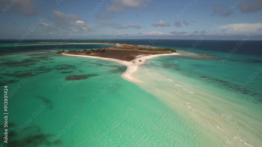 A small tropical island with white sandy beaches and turquoise waters, aerial view A small tropical island with white sandy beaches and turquoise waters, aerial view