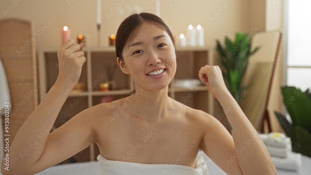 Beautiful woman enjoying a relaxing moment at a wellness center spa with candles and plants in the background Beautiful woman enjoying a relaxing moment at a wellness center spa with candles and plants in the background