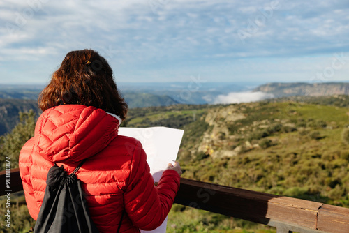 Woman reading a map at Las Janas Viewpoint, Salamanca photo