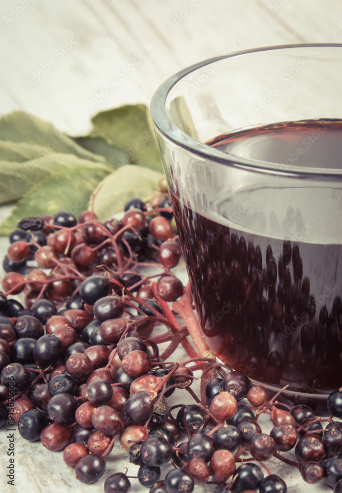 Elderberry juice and fruits as source vitamins and minerals. Healthy nutrition and natural methods of treatment Elderberry juice and fruits as source vitamins and minerals. Healthy nutrition and natural methods of treatment