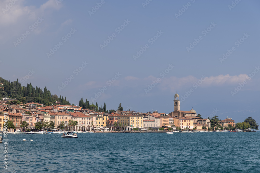 Salo charming promenade on Lake Garda, featuring bustling bar and scenic views, captures the essence of a vibrant Italian lakeside town Salo charming promenade on Lake Garda, featuring bustling bar and scenic views, captures the essence of a vibrant Italian lakeside town