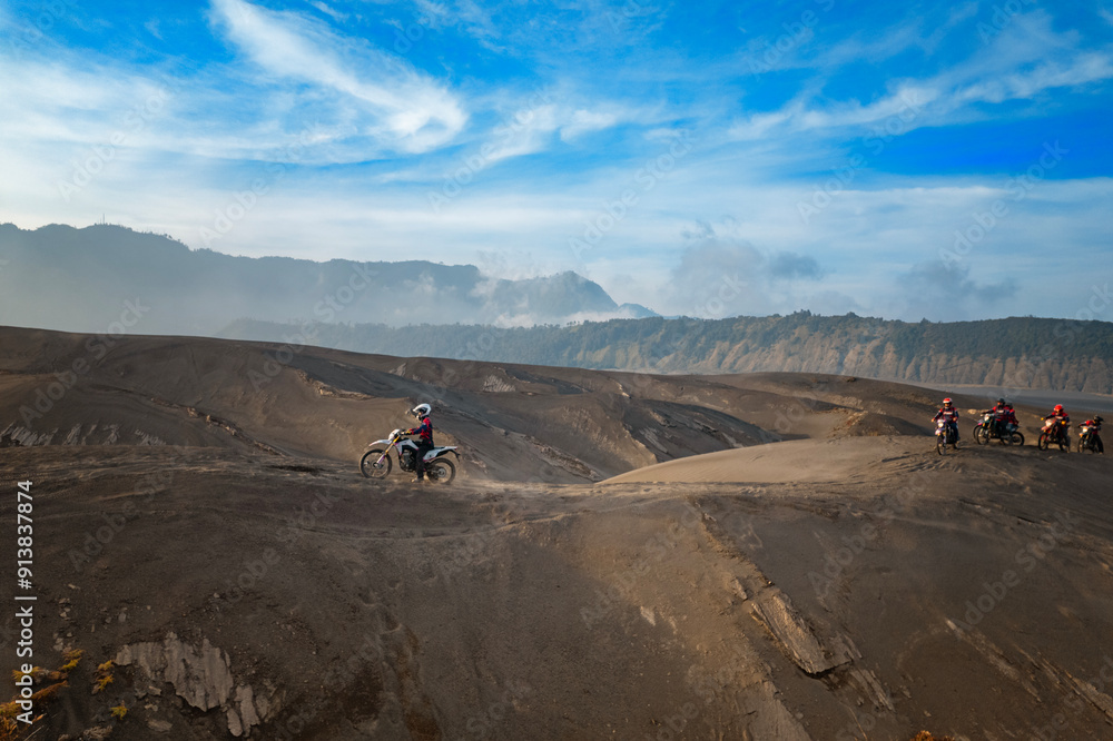 Driving at the sand dunes in the desert at the feet of Mt Bromo