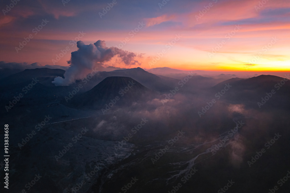 Fototapeta premium the sunset of Bromo, Indonesia with dramatic sky