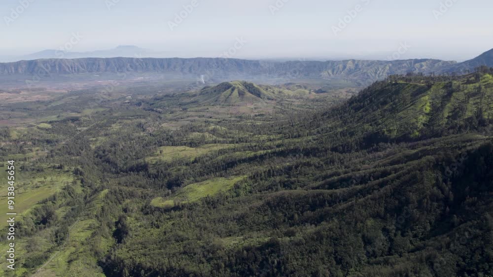 Aerial view of idyllic landscape in nature with mountains in the distance Aerial view of idyllic landscape in nature with mountains in the distance