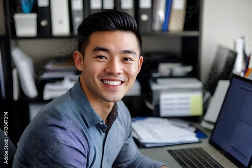 Young Asian male model wearing a shirt at work. smiling cheerfully looking at the camera