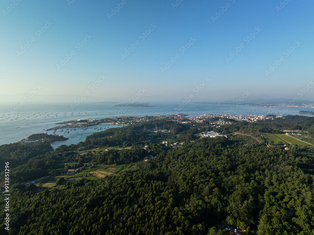 Galician coast at the opening of the Ria de Arousa at dusk, were the Atlantic ocean meets the land. Galician coast at the opening of the Ria de Arousa at dusk, were the Atlantic ocean meets the land.