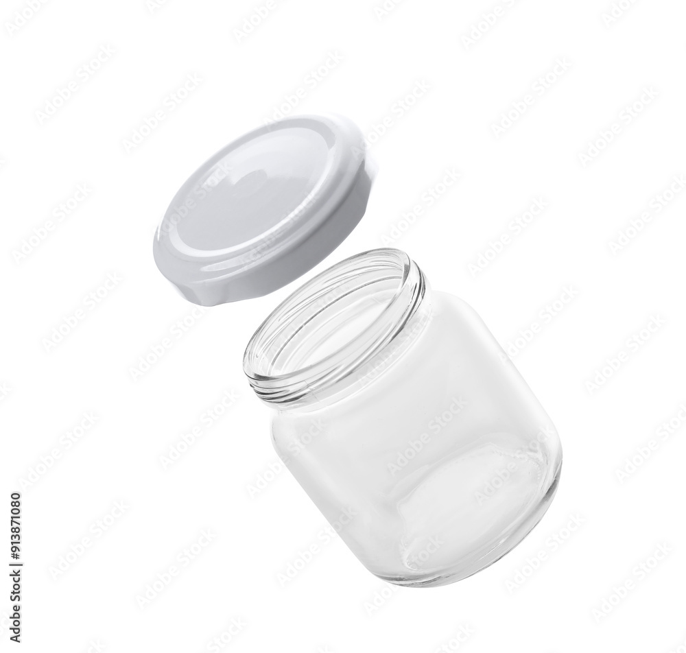 Jar and lid in air on white background Jar and lid in air on white background