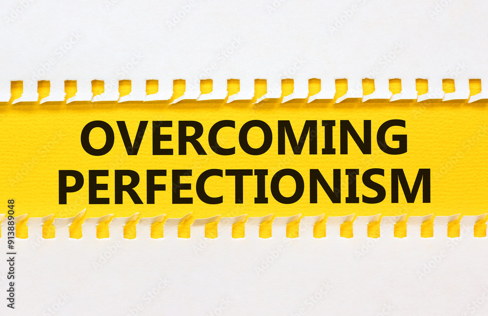 Overcoming perfectionism symbol. Concept words Overcoming perfectionism on beautiful yellow paper. Beautiful white paper background. Business Overcoming perfectionism concept. Copy space. Overcoming perfectionism symbol. Concept words Overcoming perfectionism on beautiful yellow paper. Beautiful white paper background. Business Overcoming perfectionism concept. Copy space.