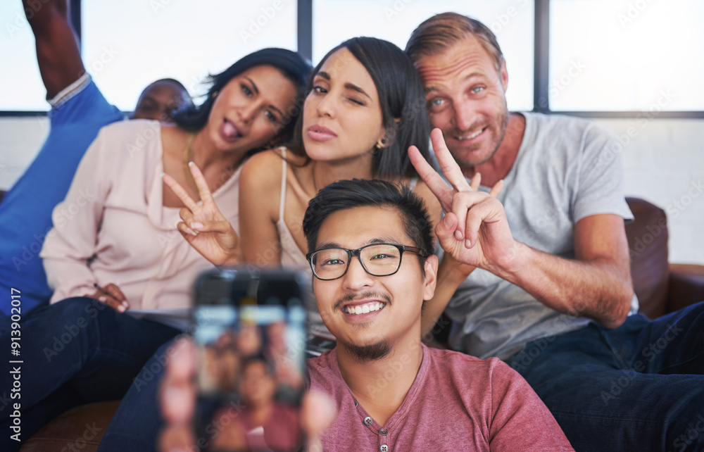 Business people, happy and selfie in office with peace, diversity and sofa for playful, joy and fun. Creative agency, smile and team in workplace with memory for collaboration, cooperation or startup Business people, happy and selfie in office with peace, diversity and sofa for playful, joy and fun. Creative agency, smile and team in workplace with memory for collaboration, cooperation or startup
