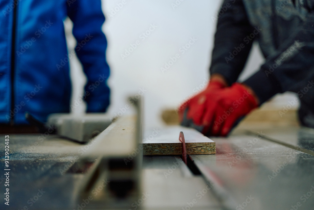 Close Up of Worker Carefully Cutting and Planing Wooden Pieces for Furniture in Wood Industry Close Up of Worker Carefully Cutting and Planing Wooden Pieces for Furniture in Wood Industry