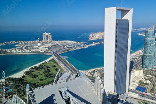 The futuristic panorama of Abu Dhabi features a stunning blend of cutting-edge skyscrapers, innovative architecture, and luxurious developments, all set against the backdrop of the Arabian Gulf photo