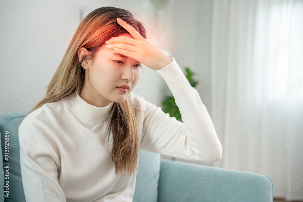 Suffer from headache desperate and stressed because pain and migraine. asian young man suffering migraine pain while working, blue isolated background, brain tumor, high cholesterol effect Suffer from headache desperate and stressed because pain and migraine. asian young man suffering migraine pain while working, blue isolated background, brain tumor, high cholesterol effect
