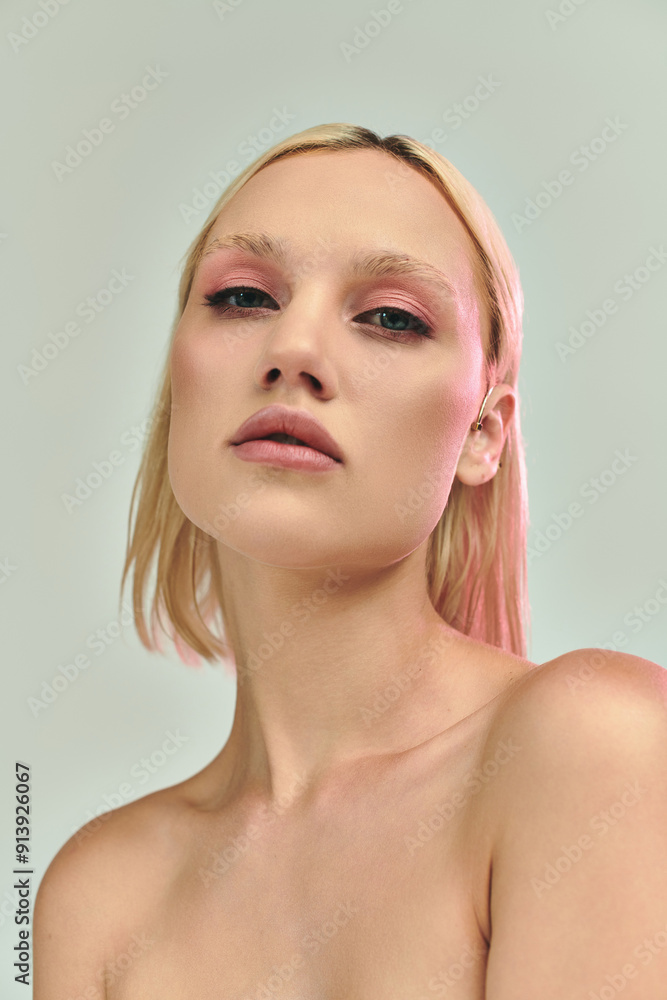 A stunning young woman showcases her chic holographic outfit with confidence. A stunning young woman showcases her chic holographic outfit with confidence.