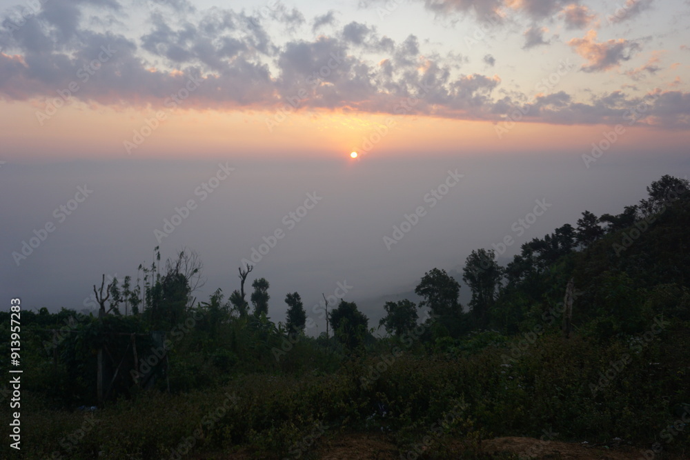 sunrise in the mountains. Beautiful Maraingtong Hill, clouds over the mountains, view from the top of mountain, view of a forest, natural beauty Bandarban. Bangladesh. sunrise in the mountains. Beautiful Maraingtong Hill, clouds over the mountains, view from the top of mountain, view of a forest, natural beauty Bandarban. Bangladesh.
